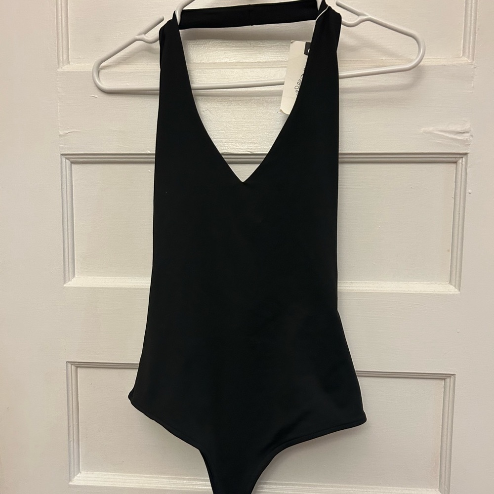 Black Reoria halter V-Neck Bodysuit
Snap crotch. Buttery soft. Lined